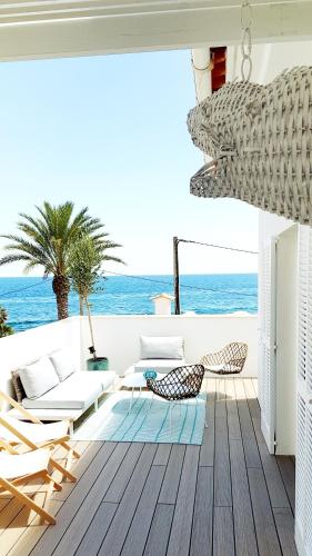 a living room with a view of the ocean at Suit Mar y Sol in Cala Ratjada