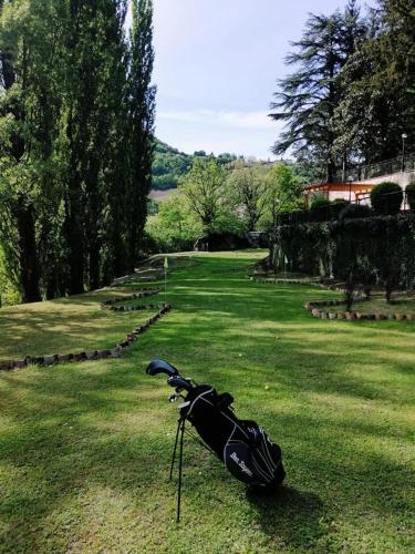 a bag sitting on the grass in a field at Convento di Acqua Premula in Sellano