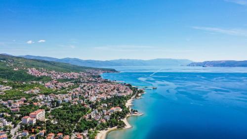 an aerial view of a town on the shore of the water at Mediteran Maradiso Hotel by Aminess in Crikvenica