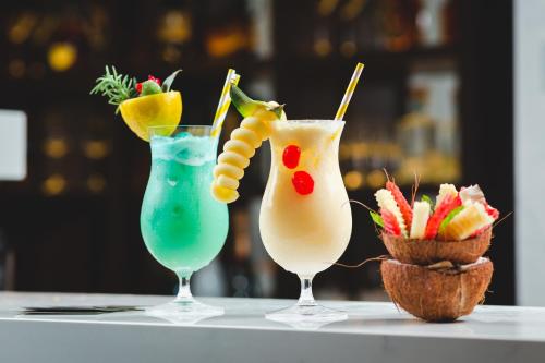 three cocktails sitting on top of a table at Boutique Hotel Vissi d'Arte in Budva