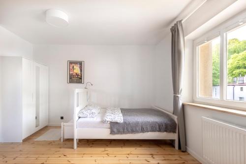 Postel nebo postele na pokoji v ubytování SeaFolks Apartments
