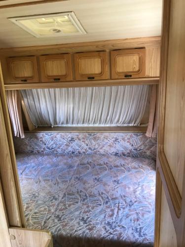 an inside view of an rv with the floor covered at Przyczepy Kemping Polaris Półwysep Helski in Chałupy