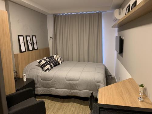 Cama ou camas em um quarto em Luxuoso e Requinte - Studio no Centro - AYN014