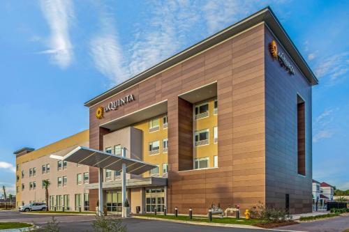 a rendering of a hotel building at La Quinta Inn & Suites by Wyndham Miramar Beach-Destin in Destin
