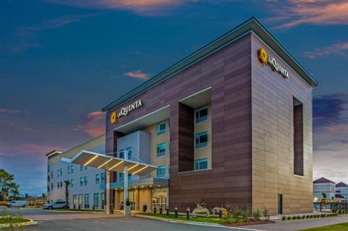 a rendering of the front of a hotel at La Quinta Inn & Suites by Wyndham Miramar Beach-Destin in Destin