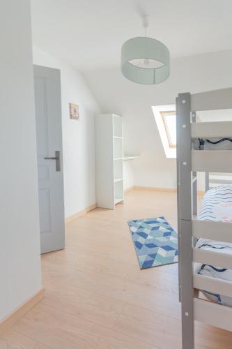 a bedroom with a bunk bed and a hallway at Villa Bellevue in Ambleteuse