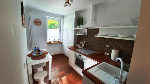Kuchyňa alebo kuchynka v ubytovaní Apartament Motylek