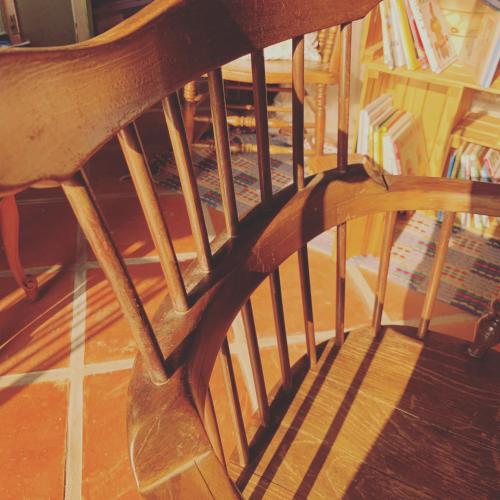 a close up of a wooden bench with a book shelf at Yamaharuka Historic House in Jinhu