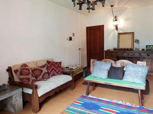 a living room with a couch and a table at Appartamento Vacanza a Santa Brigida( BG) in Santa Brigida