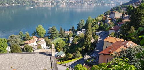 an aerial view of a town on the shore of a lake at La Terrazza sul Lago di Como con garage in Blevio