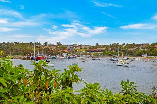 a group of boats are docked in a harbor at Sandpiper Motel Ulladulla in Ulladulla