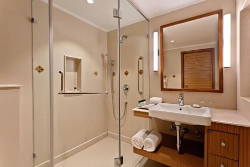 a bathroom with a sink and a shower at Welcomhotel by ITC Hotels, Bay Island, Port Blair in Port Blair