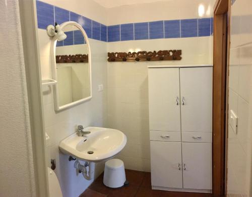 a bathroom with a sink and a mirror at Agriturismo Orione in Marina di Campo