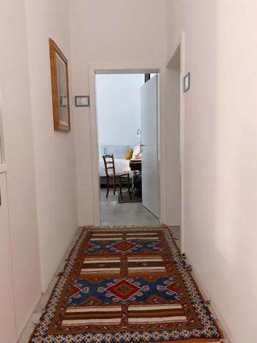 a hallway with a rug on the floor at Antica Sosta dei Viandanti in Cadenazzo