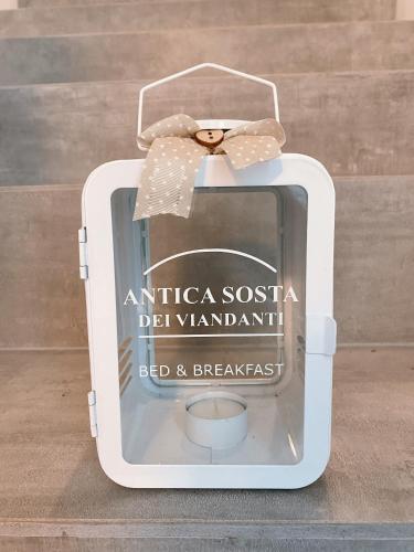 a small white box with a bow on top of it at Antica Sosta dei Viandanti in Cadenazzo