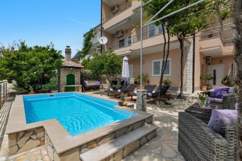a swimming pool in the backyard of a house at Villa Sukara in Makarska