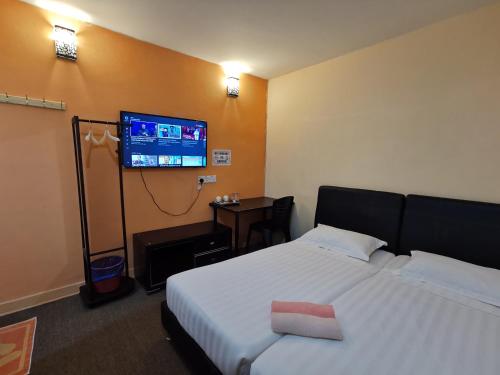 Katil atau katil-katil dalam bilik di StarVilla Kinta River Front Medan Istana