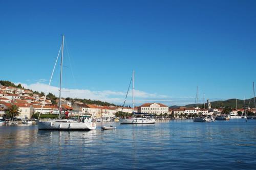 a group of boats are docked in a harbor at Apartment Seman in Vela Luka