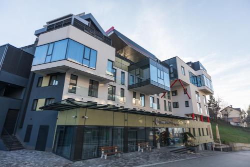a building with many windows on a street at Aparthotel Centar Sarajevo in Sarajevo