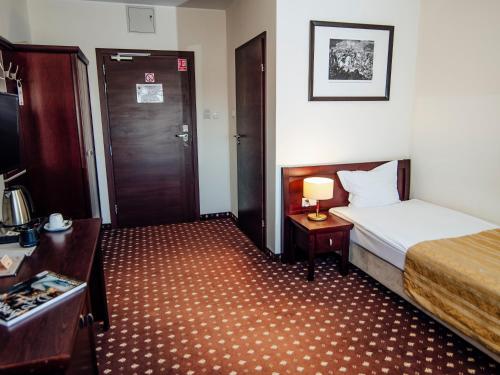 Postel nebo postele na pokoji v ubytování Hotel Zamek Gniew