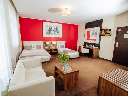 Postel nebo postele na pokoji v ubytování Hotel Zamek Gniew