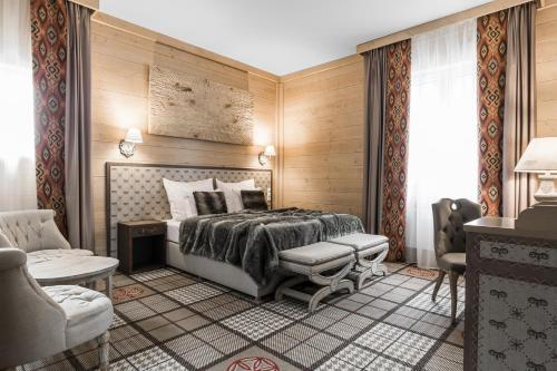 Säng eller sängar i ett rum på Aries Hotel & SPA Wisła