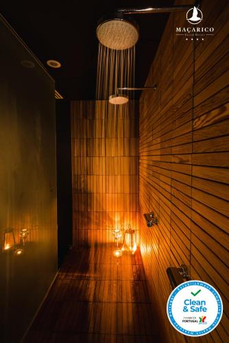 a dark room with lights on a wooden wall at Macarico Beach Hotel in Praia de Mira