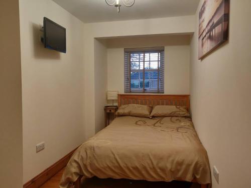 Postel nebo postele na pokoji v ubytování Courtyard Cottage - Great Paxton