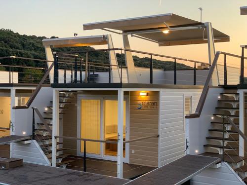 a view of a house with stairs on a yacht at Floating House - ARENA 2 in Pula