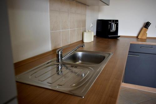 Virtuvė arba virtuvėlė apgyvendinimo įstaigoje Bouganvillia Olivielias.Air2