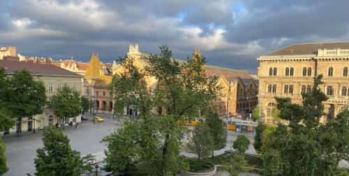 a view of a city with buildings and trees at Butterfly Home Danube in Budapest