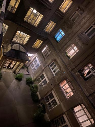 an overhead view of a building with windows and plants at Butterfly Home Danube in Budapest