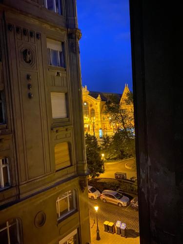 a view of a street at night from a building at Butterfly Home Danube in Budapest