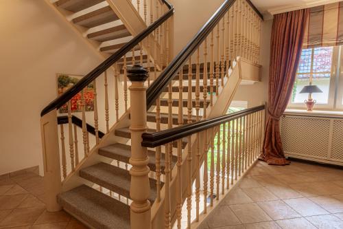 a spiral staircase in a home with a window at Strandhotel Fontana in Timmendorfer Strand