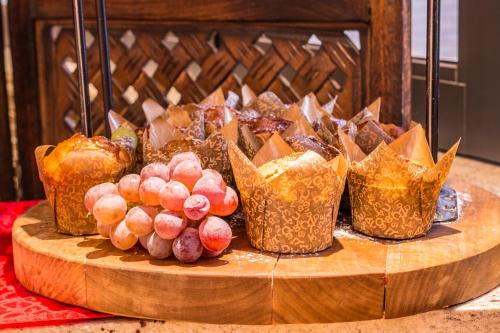 a bunch of food on a wooden table at City Lodge Hotel Hatfield, Pretoria in Pretoria