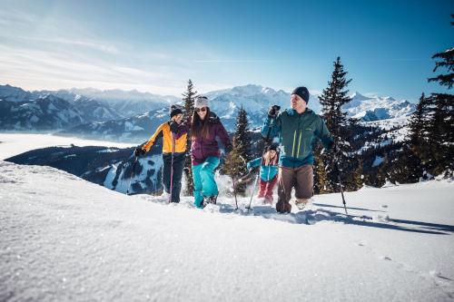 a group of people standing on top of a snow covered mountain at Pension Patricia - Summercard included from may 15th in Kaprun