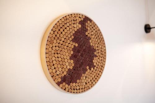 a bowl of chocolate on a white wall at Apartmány Dačický 2 in Kutná Hora