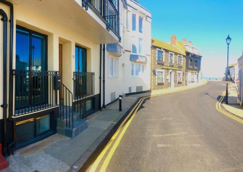 an empty street with buildings on the side of the road at The Beach House Broadstairs in Broadstairs