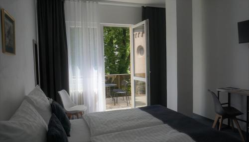Postel nebo postele na pokoji v ubytování Hotel Metropol CB