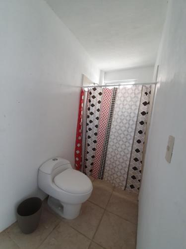 a bathroom with a toilet and a shower at Luna Azul in Tapachula