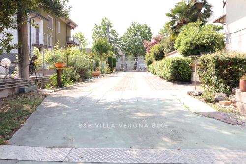 an empty street in a city with houses at B&B Villa Verona Bike in Buttapietra