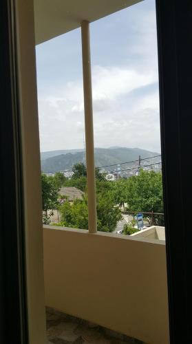 a window with a view of a city at Guesthouse different in Tbilisi City
