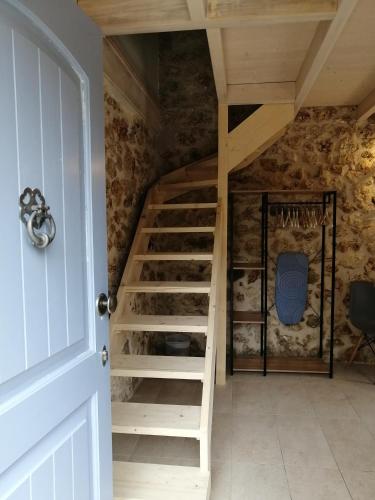 a staircase in the attic of a house at Luxurious bungalow in Ipsos beach in Ýpsos