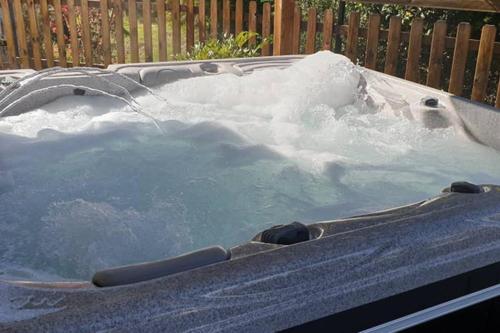 a jacuzzi tub with snow in it at La caz' à Chisy in Cilaos