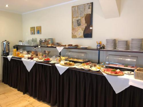a buffet line with many plates of food on it at Hotel International am Theater in Münster