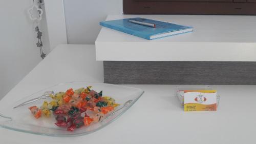 a plate of food on a table with a book at B&B OLGANNA con Parcheggi privati in Vasto