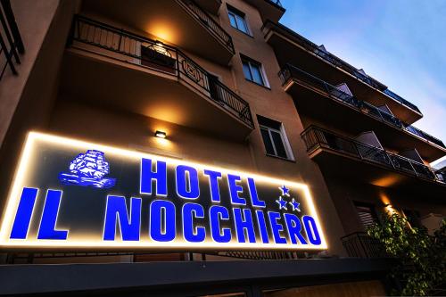a hotel sign on the side of a building at Il Nocchiero City Hotel in Soverato Marina