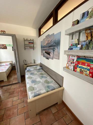 a small room with a bed in the corner at La Rondine in Trento