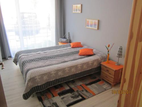 Postel nebo postele na pokoji v ubytování Apartament nad jeziorem Białym