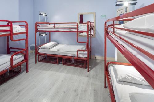 a group of bunk beds in a room at Astor Museum Hostel in London